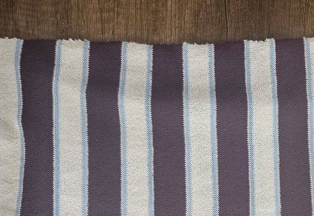 Jacquard construction — one of many textures we tune